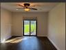 Interior space featuring wood-finish flooring, recessed lighting, and a multi-blade ceiling fan with an integrated light fixture