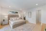 Neutral interior featuring recessed lighting, smooth-finish walls, wood-finish flooring, and a horizontal clerestory window