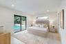 Interior space featuring recessed lighting, a horizontal clerestory window, and black-framed sliding glass doors opening to an exterior swimming pool