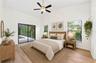 The spacious Primary Suite is filled with NATURAL LIGHT and features sliding glass doors that open directly to the pool and patio. Virtually Staged