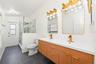The second full Bath, also COMPLETELY UPDATED IN 2026, features dual sinks, a walk-in shower and a convenient door leading directly to the pool area.