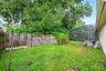 The backyard has plenty of room for gatherings and weekend barbecues.