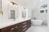The Primary en suite Bath has been COMPLETELY UPDATED IN 2026 with dual sinks, a garden tub, a step-in shower and stylish MARBLE-LOOK tile walls.