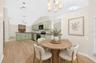 A sunny Breakfast Nook with its own ARCHED LUNETTE WINDOW provides a lovely spot for morning coffee. Virtually Staged