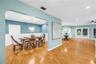 This open-concept dining area flows seamlessly into the surrounding living spaces, perfect for more social gathering