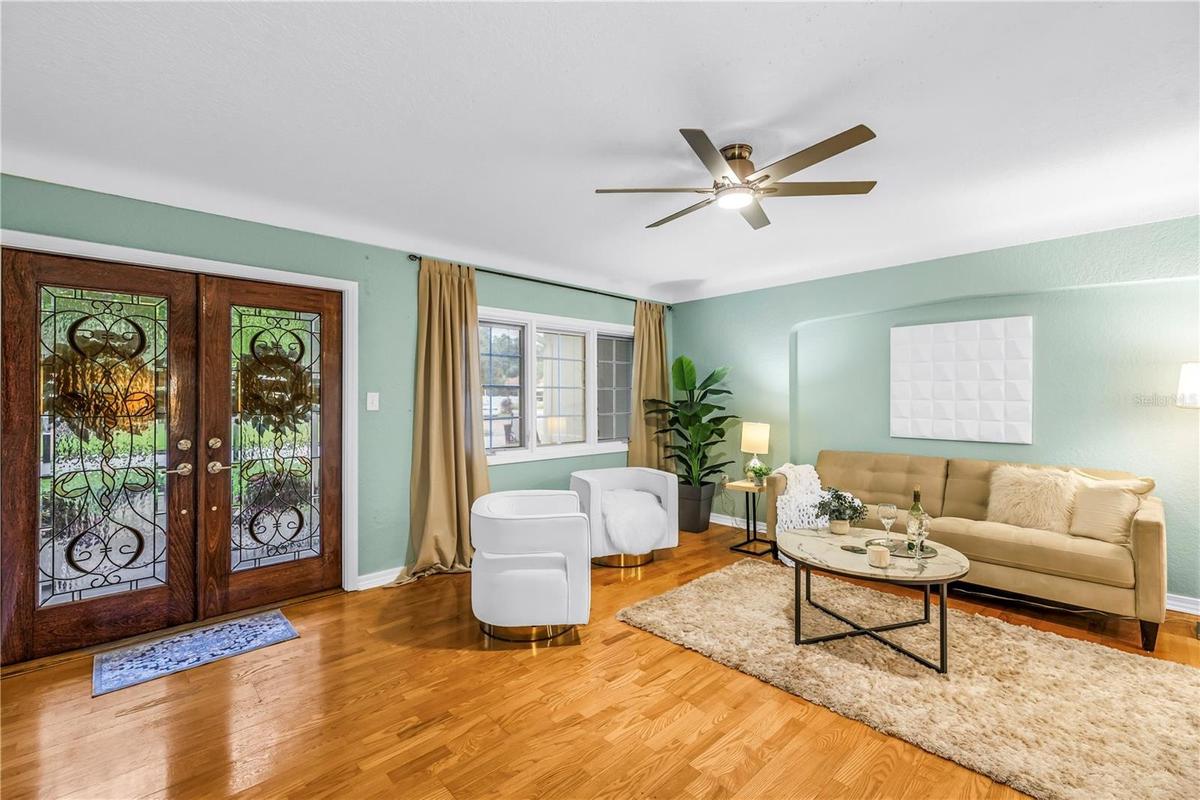 The formal living area, situated in one of St. Petersburg's most prestigious neighborhoods, offers an elegant space perfectly suited for greeting and 
