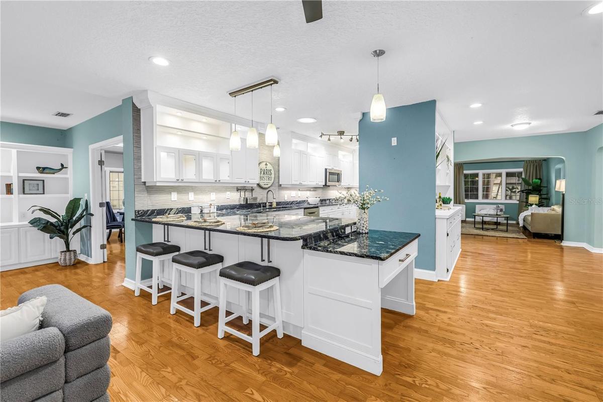 Modern lighting, illuminated cabinetry, sun tubes for natural light, and a dedicated built-in study/management area.