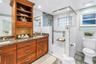 This primary bath is totally refreshed with new floors, totally updated step in shower. Dual granite vanity, upgraded cabinets and fixtures, plenty of