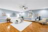 Primary Bedroom has window, French Doors to the pool and additional cooling for the perfect night's sleep.  Room also cooled by Central HVAC