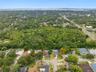 Nestled among the tree-lined streets of Spanish Pines, this residence backs onto Curlew Pond Nature Preserve.