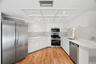 Recently refreshed with new quartz countertops, fixtures, and painted wood cabinetry.