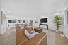 Open-concept interior featuring recessed lighting, wood-finish flooring, and multi-pane windows