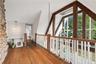 Second Level Overlooking Great Room & Wall of Windows