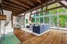 Great Room with fireplace and wall of windows