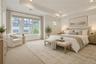 Oversized windows and elegant architectural details create a bright and inviting atmosphere, while the generous proportions provide exceptional comfor