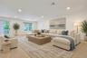 Bright and spacious with recessed lighting and oversized windows, this versatile lower-level living space is ideal for entertaining, relaxing, or work
