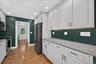 Kitchen With View Of Laundry Room And Back Mudroom