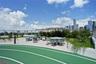 Rooftop terrace featuring a running track, concrete-paved surface, glass railing, and built-in concrete planters