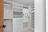 A Boutique-Style Private Dressing Room — The Aqua Guest Wing includes its own beautifully fitted walk-in dressing room, with extensive custom shelving