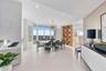The formal dining room is perfectly positioned to capture breathtaking panoramic western views across the Intracoastal Waterway and all of Broward Cou