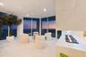 Capturing sweeping views of the Atlantic Ocean, coastline and distant skyline. The curved glass creates an almost panoramic connection to the horizon,