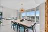 Personally designed by internationally acclaimed designer Alessandro Potenti, this breathtaking formal dining room showcases panoramic Atlantic Ocean 