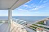 Sweeping southeast views unfold from the penthouse’s wide, covered European-porcelain balcony, capturing the turquoise Atlantic, miles of Fort Lauderd