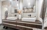Floating wood-finish vanity with dual rectangular vessel sinks, quartz-finish countertop, matte black wall-mounted faucets, and two rectangular mirror