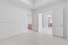 Tray ceiling, large-format tile flooring, and Shaker-style interior doors