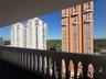 High-rise towers featuring articulated masonry facades, symmetrical fenestration, integrated balconies, and multi-story architectural detailing