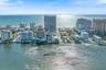 Coastal urban skyline featuring high-rise architecture, direct waterfront access, and expansive ocean frontage