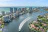 Aerial perspective of the coastline featuring deep-water access, a prominent maritime channel, high-rise buildings, and extensive waterfront propertie