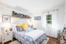 Shiplap wall, exusing warmth and style. Hardwood Floor.