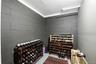 Insulated and lockable room for wine storage.