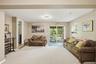 Above grade lower level walkout with full bath for fitess, yoga or recreating.