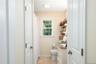 Hallway Full Bath with granite vanity.