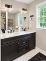 Beautiful, tasteful, high end Primary bath with tile and vanity upgrades.