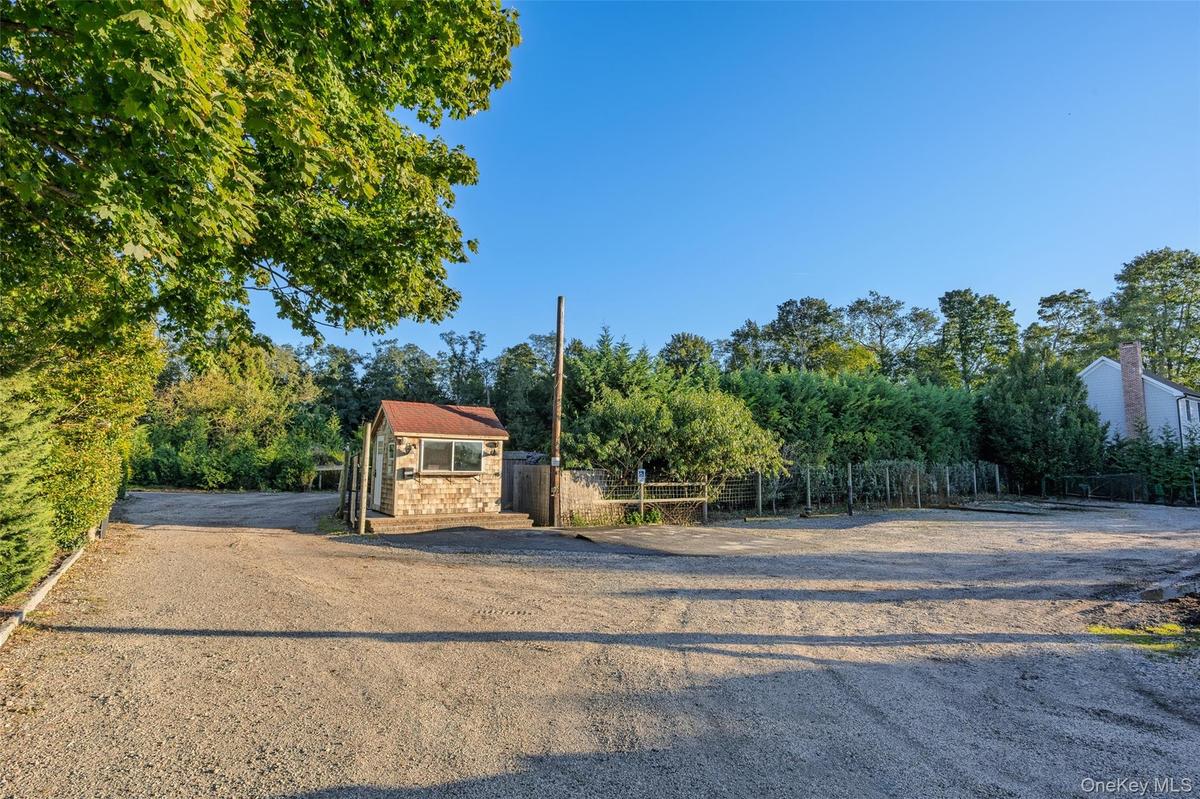 Property entrance (vehicles digitally removed to show size)