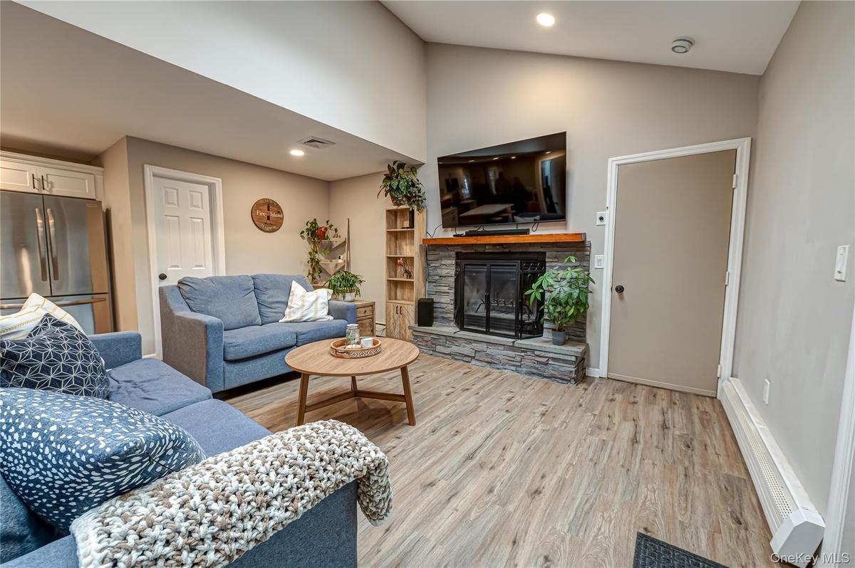 living area with full bath and garage entrances