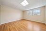 Photo was Enhanced - Decluttered. Actual Flooring is Carpet.