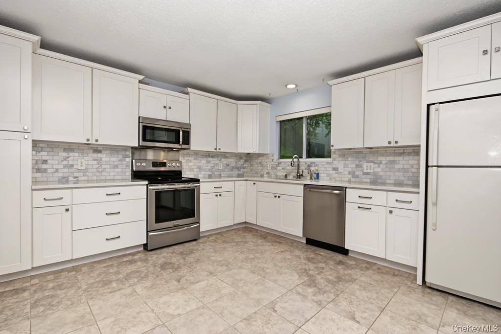 Kitchen has stainless appliances