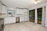 Quartz counters and marble backsplash in Kitchen