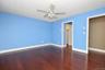 Primary Bedroom has ceiling fan with light