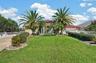 Welcoming Entrance with Tropical Landscaping