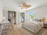 Spacious bedroom featuring dual closets.