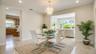 Bright, spacious formal dining room with elegant finishe