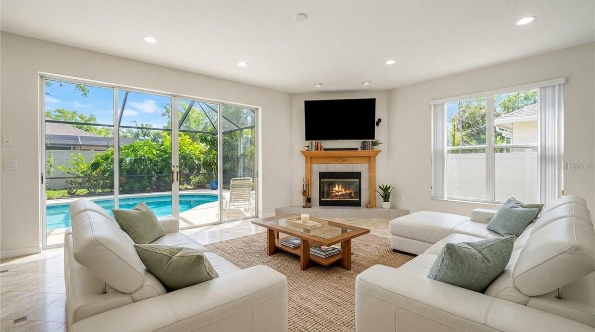 Spacious living room featuring an open-concept design with seamless entry access.