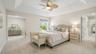 Master bedroom with exterior access and private balcony.