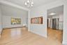 Dining room with brand new lighting anf oak wood floors