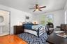 The third ensuite bedroom offers a welcoming private retreat, featuring beautiful pinewood floors, a private bath with a tub/shower combination, and i